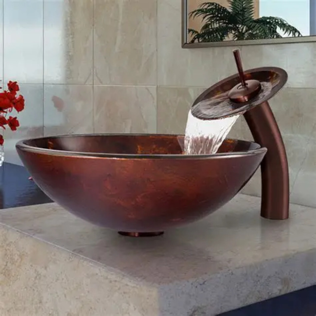 Plumber installing a kitchen sink